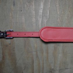 Vintage style guitar strap made with a topgrain leather top and an upholstery backing. Black & Red